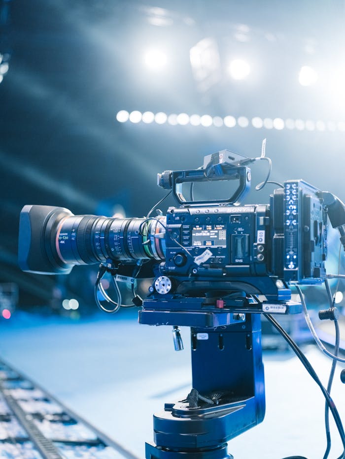 services-03 High-end professional video camera setup for filming on set with bright stage lights.